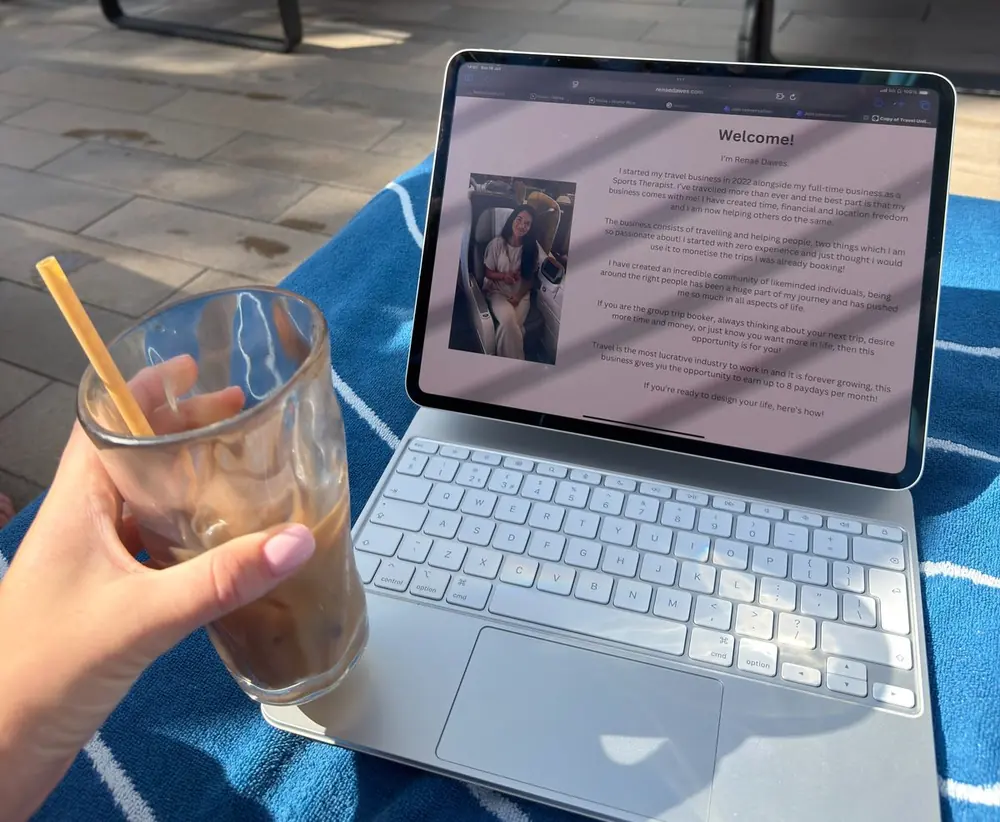 Iced coffee and a laptop open by a pool